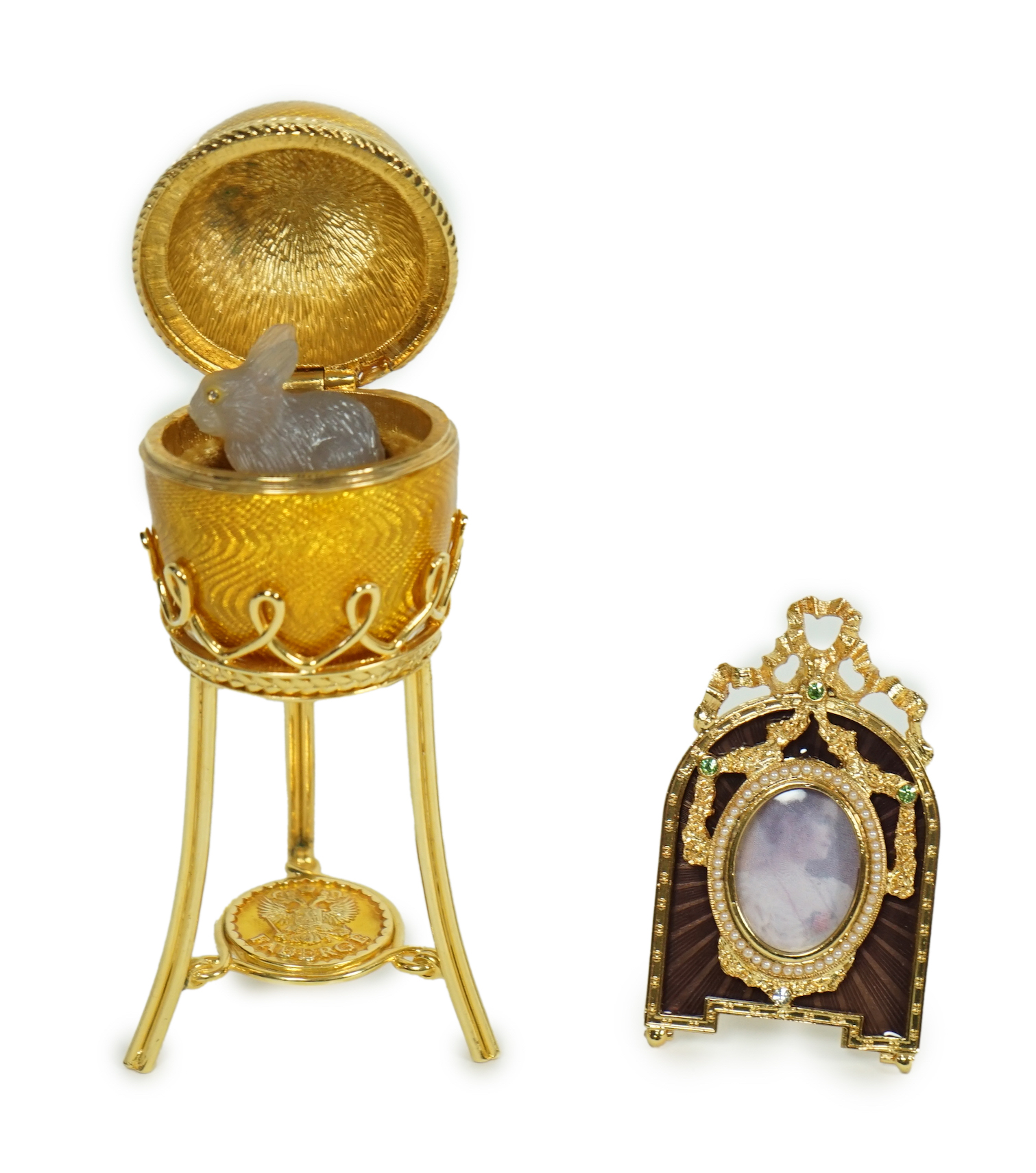 A Fabergé Imperial Collection Menagerie Rabbit Surprise Egg on stand together with a Fabergé gilt and enamel photograph frame